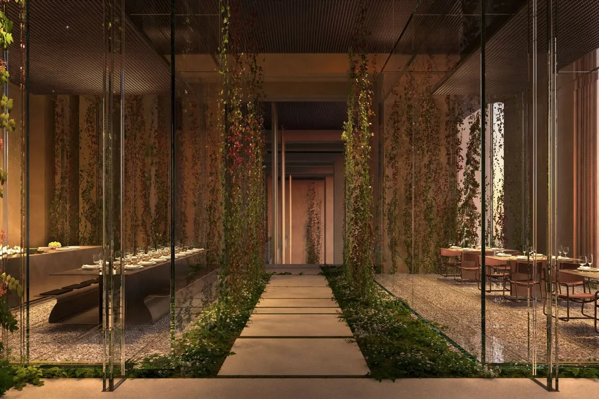Glass dining rooms either side of a planted stone path